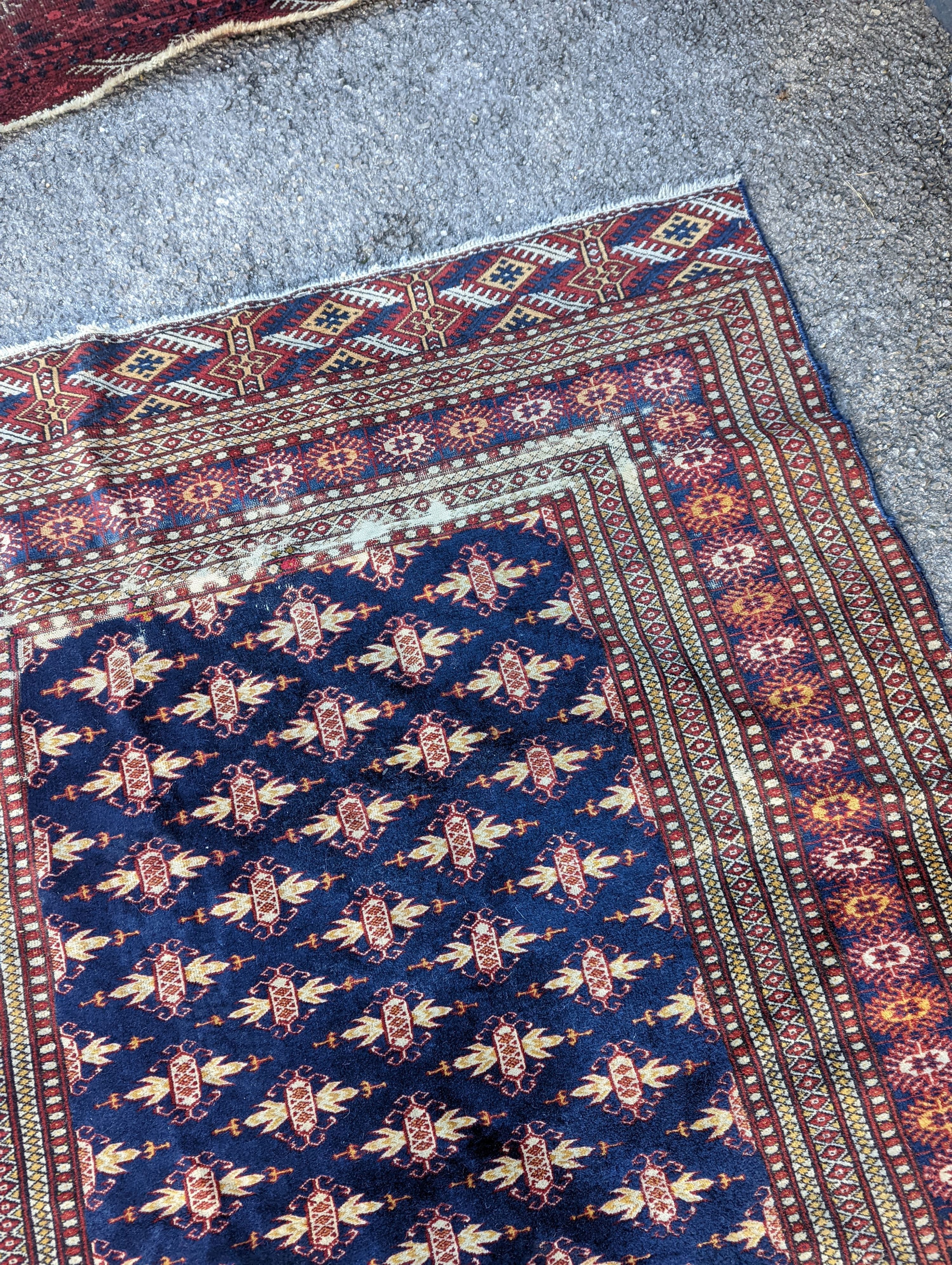 A Bokhara blue ground rug, 191 x 126cm